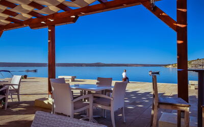 Maslenica 107: Water, Sky, Table, Furniture, Property, Blue, Azure, Chair, Shade, Wood