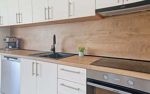 Frane: Flooring, Wood, Countertop, Floor, Furniture, Cabinetry, Kitchen, Interior Design, Brown, Wood Flooring