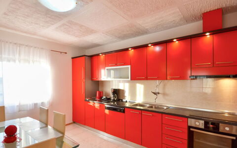 Frane: Countertop, Room, Property, Cabinetry, Interior Design, Red, Kitchen, Furniture, Ceiling, Building