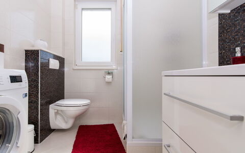 Trogir Okrug Gornji 314: Plumbing Fixture, Laundry Room, Toilet Seat, Cabinetry, Building, Toilet, Flooring, Bathroom, Floor