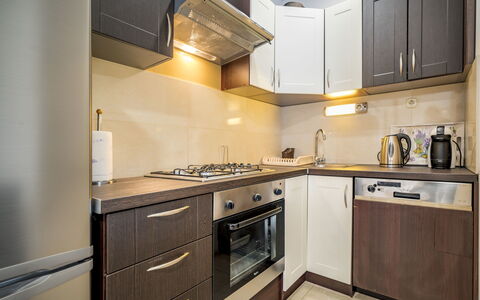 Jozo: Countertop, Cabinetry, Kitchen, Room, Property, Furniture, Interior Design, Major Appliance, Yellow, Building