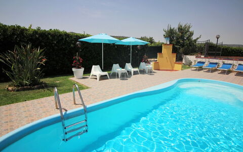 Andrea: Water, Plant, Sky, Property, Swimming Pool, Azure, Shade, Outdoor Furniture, Sunlounger, Tree