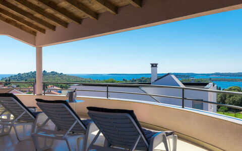 Carmen: Sky, Property, Furniture, Water, Shade, Seaside Resort, Table, Outdoor Furniture, Chair, Wood