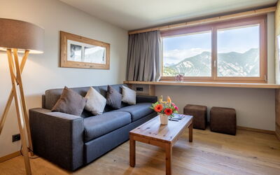 Swisspeak Resorts Vercorin 9000.124: Interior Design, Ceiling, Room, Hardwood, Living Room, Alps, Lamp, Pillow, Suite