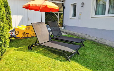 Seehaus Blue Faak: Furniture, Plant, Window, Umbrella, Outdoor Furniture, Shade, Tree, Rectangle, Grass, Comfort