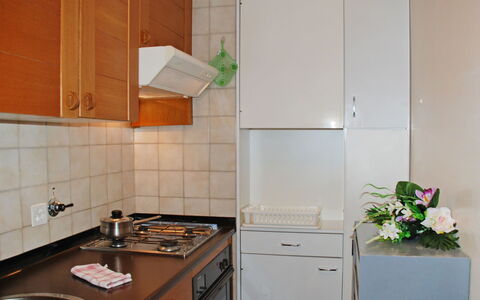 Vista Lago: Room, Property, Kitchen, Cabinetry, Countertop, Tile, Furniture, Kitchen Stove, Major Appliance, House