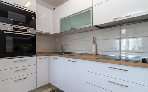 Melita Lara: Cabinetry, Countertop, Building, Kitchen, Kitchen Stove, Drawer, Kitchen Appliance, Wood, Flooring, Wood Stain