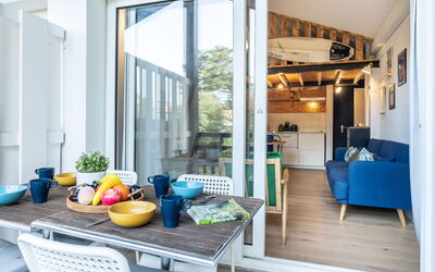 Kantaldi 107.2: Table, Furniture, Property, Couch, Azure, Interior Design, Building, Orange, Window, Comfort