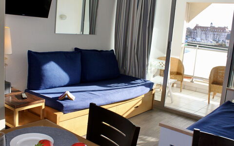 Le Beach: Table, Furniture, Comfort, Azure, Living Room, Wood, Pillow, Architecture, Couch, Bed Frame