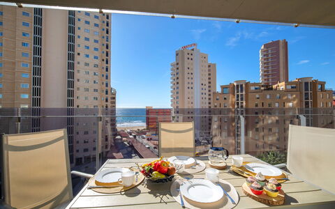 Mirador de Calpe: Table, Tableware, Building, Sky, Property, Daytime, Furniture, Skyscraper, Window, Food