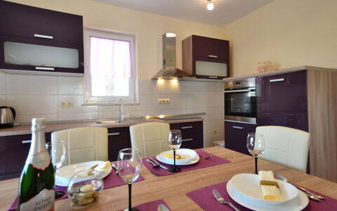 Dević: Table, Tableware, Cabinetry, Property, Furniture, Dishware, Countertop, Kitchen, Bottle, Kitchen Appliance