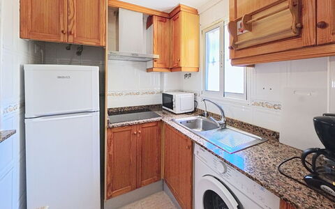 Residencial Daly: Major Appliance, Kitchen, Wood, Flooring, Countertop, Floor, Kitchen Appliance, Interior Design, Cabinetry, Home