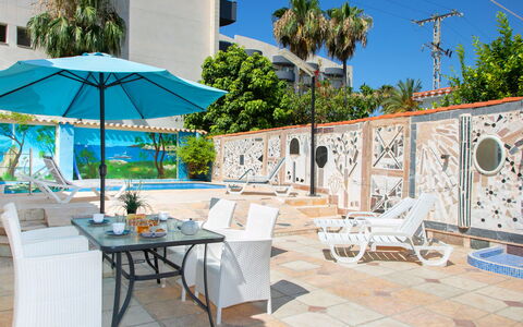 Pedro: Furniture, Table, Property, Plant, Azure, Tree, Sky, Building, Shade, Outdoor Table