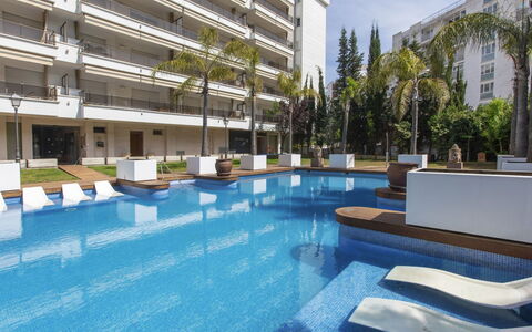 Punta Garbí: Building, Water, Plant, Swimming Pool, Sky, Azure, Shade, Interior Design, Outdoor Furniture, Tree