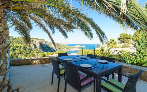 Solymar: Table, Sky, Water, Furniture, Plant, Botany, Azure, Seaside Resort, Outdoor Table, Tree