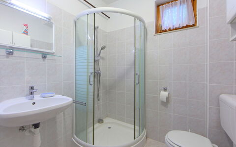 Golf Tee: Bathroom, Property, Room, Plumbing Fixture, Architecture, Interior Design, Tile, Shower Door, Tap, Real Estate
