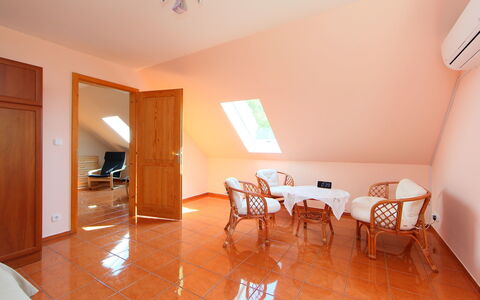 Golf Tee: Room, Property, Floor, Building, Furniture, House, Interior Design, Real Estate, Wood Flooring, Ceiling