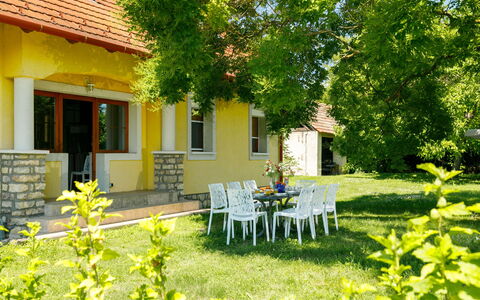 Golf Tee: Plant, Building, Property, Window, Furniture, Botany, Leaf, Tree, Chair, House