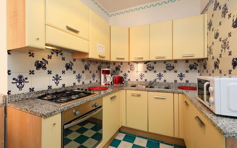 Bouganville: Property, Room, Kitchen, Cabinetry, Real Estate, Interior Design, Tile, Furniture, Countertop, Yellow