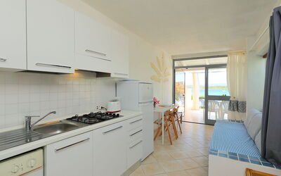 Vista Mare 4 730.4: Cabinetry, Building, Countertop, Property, Kitchen Appliance, Kitchen Stove, Cooktop, Wood, Kitchen, Gas Stove