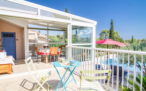 Les Hauts de Palayson: Sky, Plant, Shade, Door, Building, Outdoor Furniture, Table, Leisure, Tree, Chair