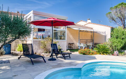 Les Hauts de Palayson: Sky, Plant, Water, Property, Blue, Azure, Building, Shade, Swimming Pool, Outdoor Furniture