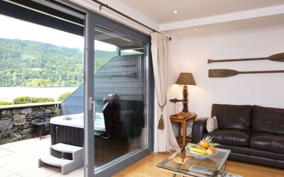Loch Tay 101.3: Room, Property, Furniture, Interior Design, Living Room, House, Building, Real Estate, Door, Table