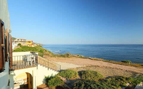 Valledoria 735: Sky, Plant, Water, Building, Azure, Coastal And Oceanic Landforms, Wood, Terrain, House, Condominium
