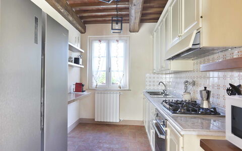Il Grappolo: Countertop, Property, Room, Kitchen, Furniture, Building, Floor, Cabinetry, Interior Design, Ceiling