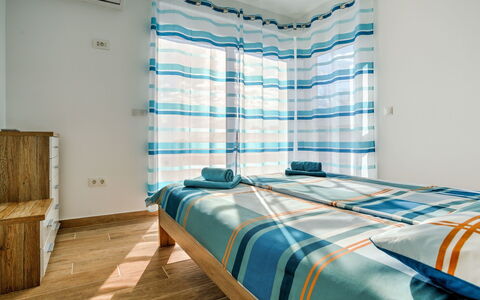 Races: Bedroom, Room, Bed, Property, Bed Sheet, Furniture, Turquoise, Bed Frame, Interior Design, Wall