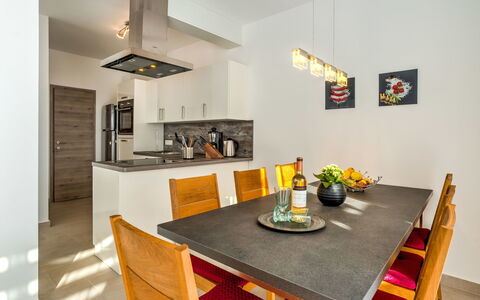 Races: Room, Property, Dining Room, Furniture, Interior Design, Yellow, Table, Countertop, Building, House