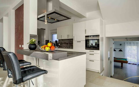 Races: Countertop, Room, Property, Furniture, Kitchen, Cabinetry, Interior Design, Building, Yellow, House