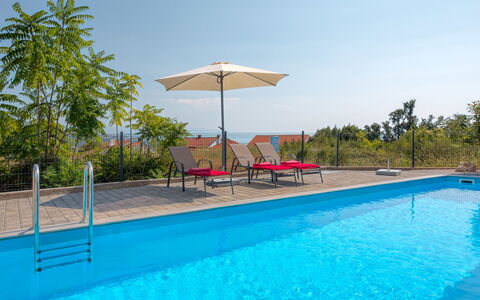 Races: Water, Sky, Plant, Property, Swimming Pool, Shade, Outdoor Furniture, Tree, Sunlounger, House