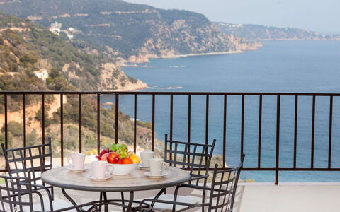 Sky Bleu Salions: Property, Furniture, Balcony, Room, Table, Vacation, Sea, House, Ocean, Coast