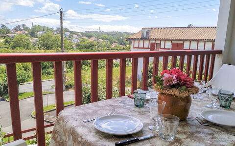 Hego Alde: Sky, Table, Plant, Cloud, Furniture, Tableware, Flower, Property, Building, Chair