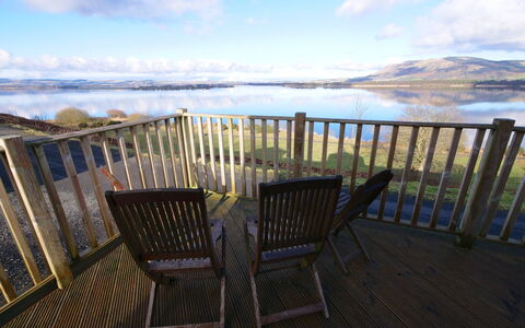 Loch Leven Lodge: Cloud, Sky, Water, Property, Daytime, Furniture, Nature, Fence, Chair, Wood