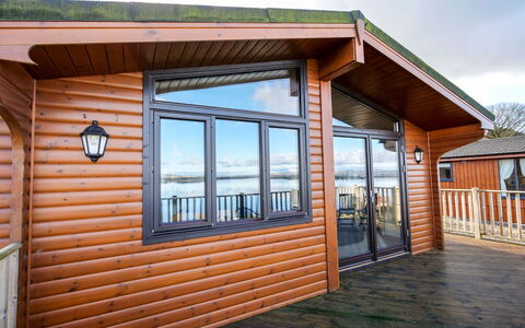 Loch Leven Lodge: Sky, Window, Building, Wood, Cloud, Shade, Cottage, Siding, House