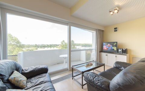 Maya - Parking and Distant View: Couch, Furniture, Property, Building, Comfort, Shade, Table, Wood, Living Room, Floor