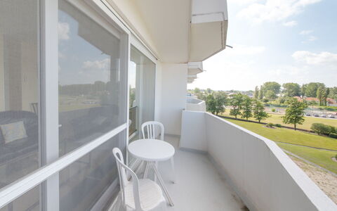 Maya - Parking and Distant View: Sky, Building, Plant, Shade, Cloud, Condominium, Floor, House, Tree, Window