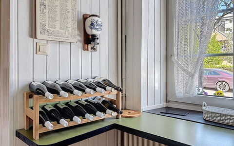 Moselhäuschen: Bottle, Kitchen, Wood Stain, Wine Bottle, Glass Bottle, Cabinetry, Countertop, Hardwood