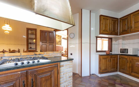 Casa Alexandra: Countertop, Cabinetry, Furniture, Mirror, Wood, Drawer, Kitchen, Lighting, Interior Design, Houseplant