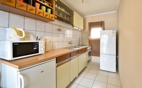 Marijana: Cabinetry, Countertop, Furniture, Building, Kitchen Appliance, Kitchen Stove, Kitchen, Wood, Home Appliance, Flooring