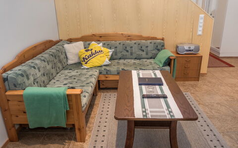 Karhunvartijan Linna B14: Furniture, Flooring, Wood, Floor, Interior Design, Couch, Table, Room, Wood Stain, Living Room