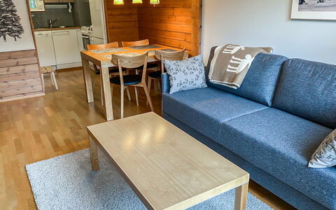 Ylläs Chalets A307: Furniture, Flooring, Wood, Floor, Interior Design, Couch, Apartment, Living Room, Wood Flooring, Room