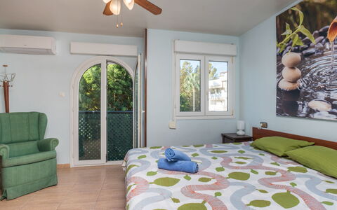 Atria: Ceiling Fan, Bedroom, Room, Bed, Furniture, Property, Bed Sheet, Bed Frame, Interior Design, Green