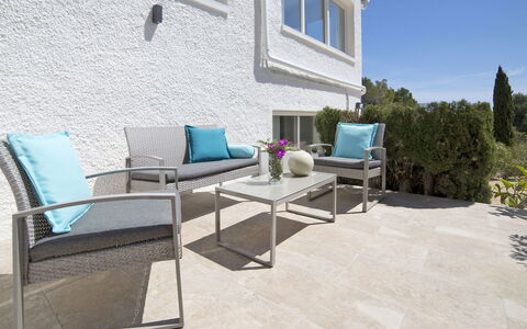 Nelli: Furniture, Window, Building, Sky, Table, Shade, Plant, Outdoor Furniture, Road Surface, Interior Design