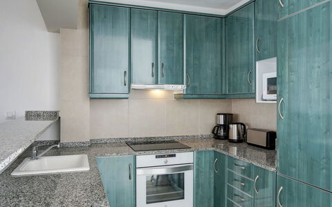 Las Estancias: Countertop, Room, Property, Cabinetry, Kitchen, Furniture, Turquoise, Interior Design, Tile, Building