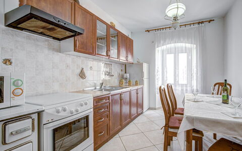 Branko: Furniture, Cabinetry, Table, Countertop, Chair, Building, Kitchen Stove, Wood, Lighting, Drawer