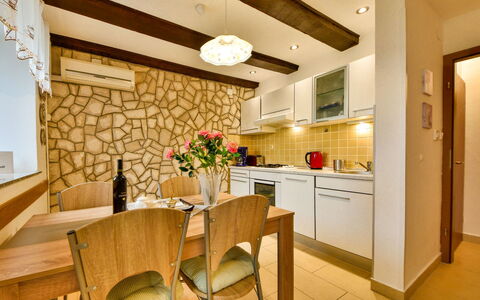 Divna: Furniture, Table, Property, Cabinetry, Chair, Flower, Plant, Houseplant, Countertop, Wood