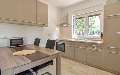 Romina: Furniture, Kitchen, Countertop, Kitchen Appliance, Interior Design, Cabinetry, Flooring, Wood, Major Appliance, Floor